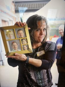 Nicole holding photo collage